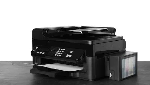 New modern multifunction printer on grey table Fotos de archivo