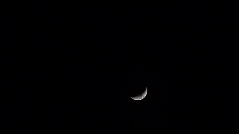 New moon on black background. Stock Footage 105446975