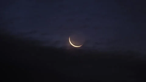 New moon in the initial phase on a dark night sky, time lapse Stock Footage 239814923