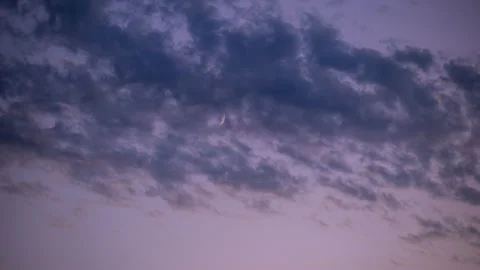 New Moon Sets through, Blue, Pink and Purplish Clouds Stock Footage 283937231