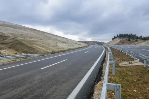 New motorway under construction with dramatic clouds Фото