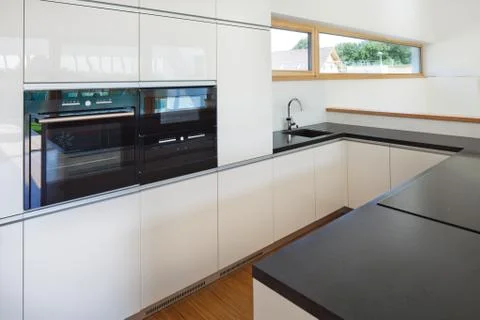 New nice kitchen in interior of new house Stock Photos