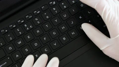 The new normal after the covid-19, hands typing on shared computer keyboard a Stock Footage 136138593