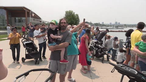 New normal after COVID with crowds of people outside enjoying a festival Stock Footage 157618041