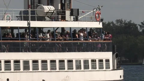 New normal after COVID with crowds of tourists and people in city and boats Video stock 158899617
