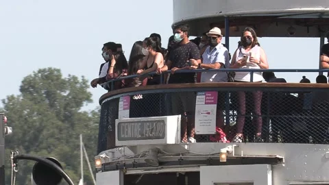 New normal after COVID with crowds of tourists and people in city and boats Video stock 158899683