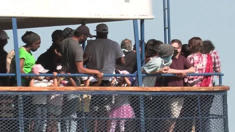 New normal after COVID with crowds of tourists and people in city and boats Video stock 158899709