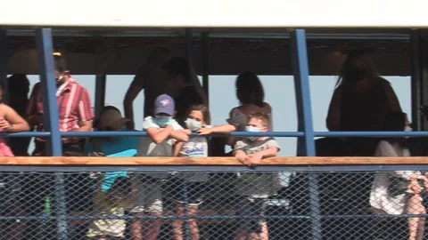 New normal after COVID with crowds of tourists and people in city and boats Video stock 158900399