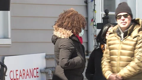 New normal COVID 19 Two people talking and wearing face masks on city street Stock Footage 151569423