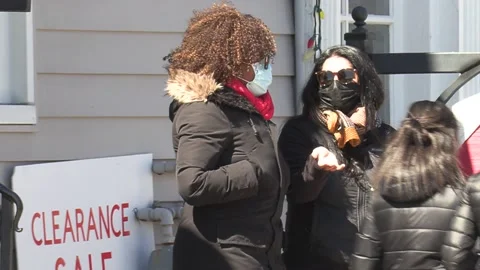 New normal COVID 19 Two people talking and wearing face masks on city street 库存影片 151569436