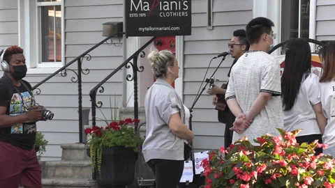 New normal  COVID small town main street Canada with people and face masks Видео 156423465