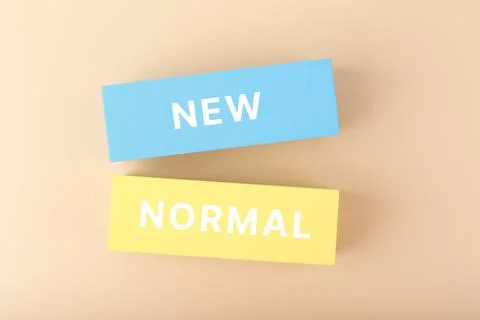 New normal minimal concept. Text on yellow and blue rectangles against pastel Stock Photos