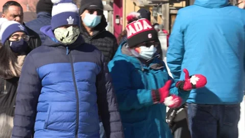 New normal with people walking down street wearing face masks in COVID pandemic Stock Footage 149996084