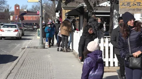 New normal with people walking down street wearing face masks in COVID pandemic Stockbeeldmateriaal 149996111