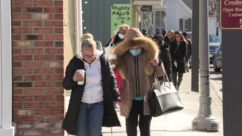 New normal with people walking on sidewalk wearing face masks in COVID pandemic 動画素材 149994272