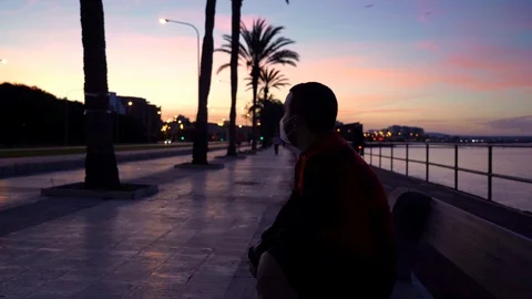 New normal: a roller rests on a bench between the sea and the city 스톡 동영상 129616203