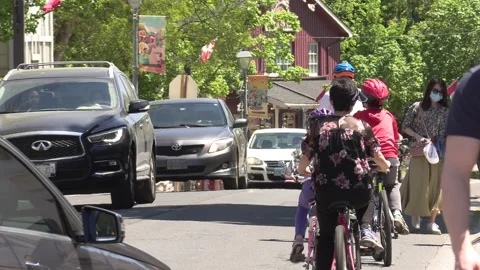 New normal on small town main street with people wearing COVID 19 face mask Video stock 154621963