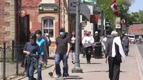 New normal on small town main street with people wearing COVID 19 face mask Stock-Footage 154622055