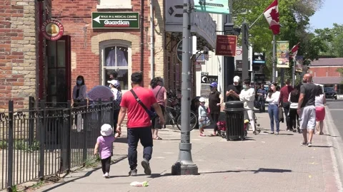 New normal on small town main street with people wearing COVID 19 face mask Stock-Footage 154622140