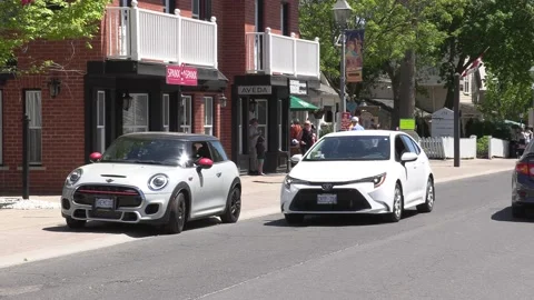 New normal on small town main street with people wearing COVID 19 face mask 動画素材 154622404