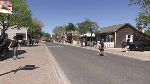 New normal on small town main street with people wearing COVID 19 face mask 库存影片 154623021