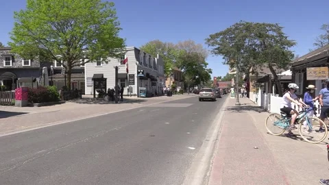 New normal on small town main street with people wearing COVID 19 face mask Video stock 154624203