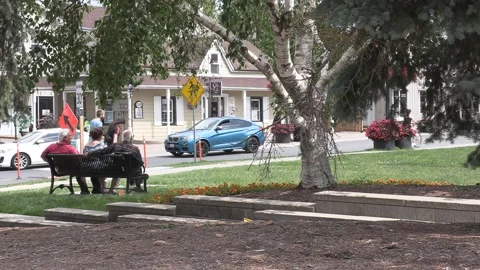 New normal  small town main street Canada with people wearing COVID face masks Видео 156381809
