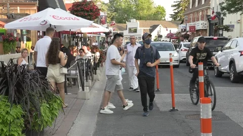 New normal  small town main street Canada with people wearing face masks Видео 156392220