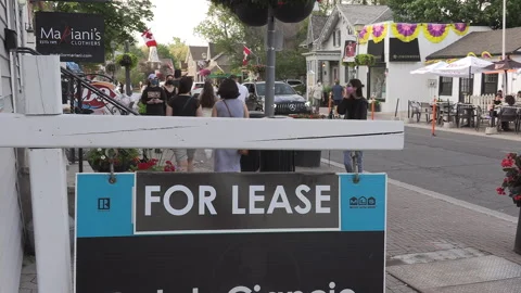 New normal  small town main street Canada with people wearing COVID face masks 스톡 동영상 156397180