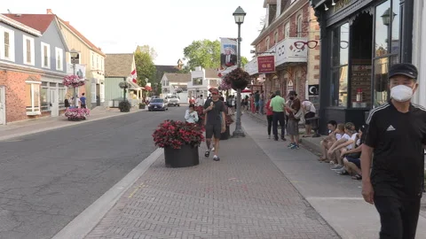 New normal  small town main street Canada with people wearing COVID face masks Stockbeeldmateriaal 156399405