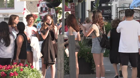 New normal  small town main street Canada with people wearing COVID face masks Vídeos de archivo 156405599