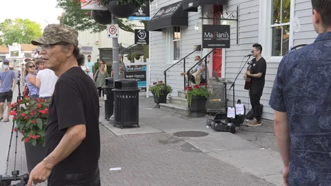 New normal  small town main street Canada with people wearing COVID face masks Видео 156419291