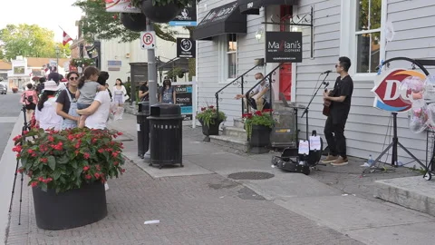 New normal  small town main street Canada with people wearing COVID face masks Видео 156420016
