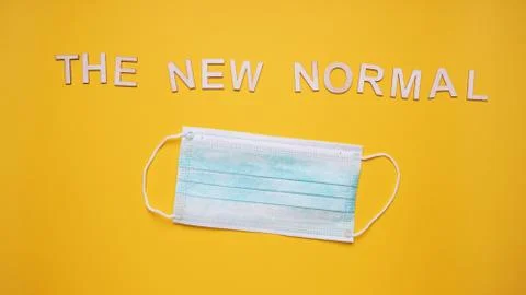 The new normal text with face mask Stock Photos