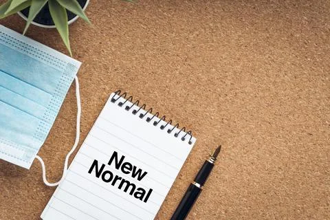 NEW NORMAL text with face mask, notepad, fountain pen and  decorative plant o 写真素材