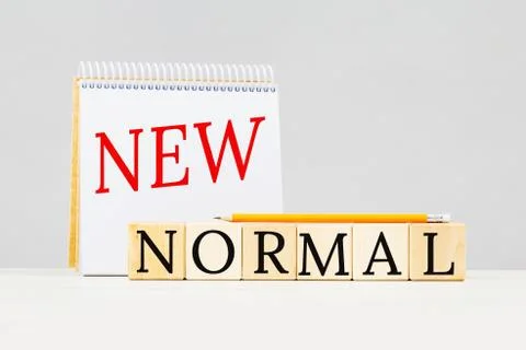 New Normal text on notepad and building blocks Stock Photos