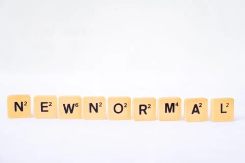 New Normal word on rustic plastic tiles alphabet puzzle board game. Stock Photos