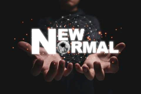 New normal wording on 2 hands. The world is changing to balance Stock Photos