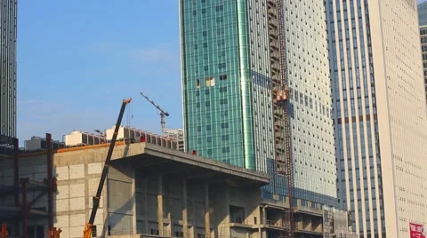 New office building under construction on blue sky. Building construction of hug Stock Footage 55961946