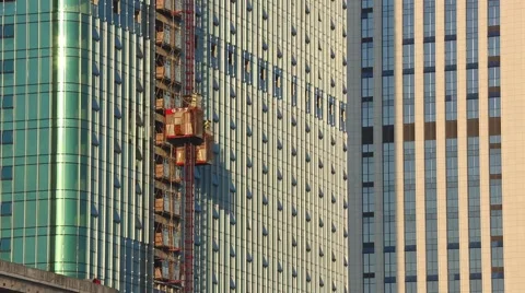 New office building under construction on blue sky. Building construction of hug Stock Footage 55962237