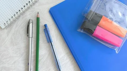 The new office is on the white table. Purchase of office supplies by the be.. Stock Photos