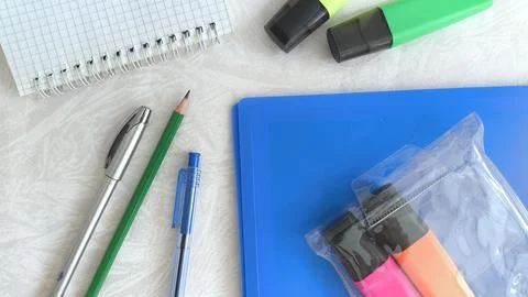 The new office is on the white table. Purchase of office supplies by the Stock Photos
