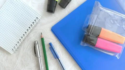 The new office is on the white table. Purchase of office supplies by the Stock Photos