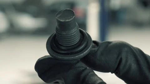New oil pan plug Stock Footage 138633103