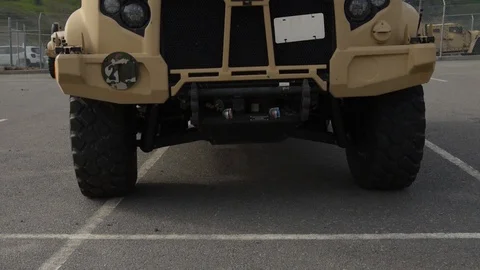 New Oshkosh joint light tactical vehicle parked at Camp Pendleton, California Stock Footage 104601074
