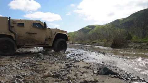 New Oshkosh joint light tactical vehicle being test driven by Marines Stock Footage 104601181