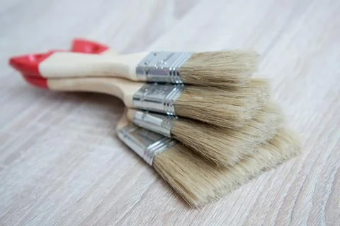 New paint brushes of different sizes. The concept of choice and diversity. Stock Photos