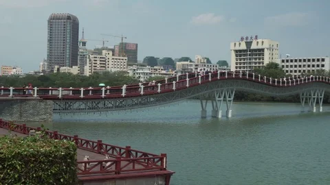 New pedestrian bridge Rainbow across the Sanya River stock footage video Stock Footage