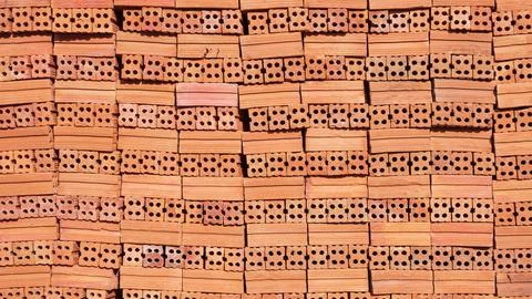 New perforated brick construction material stacked background, Pile of red .. 写真素材