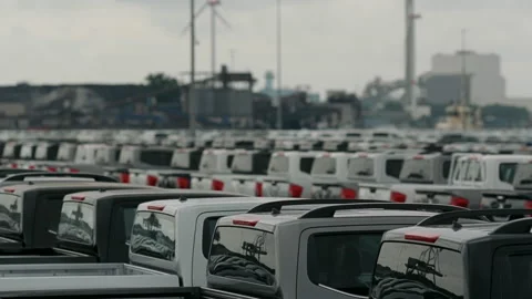 New pickup trucks parked in a large automobile terminal Stock Footage 334784748